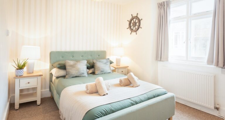 self-catered holiday let double bedroom with coastal decor provided by Jurassic Properties