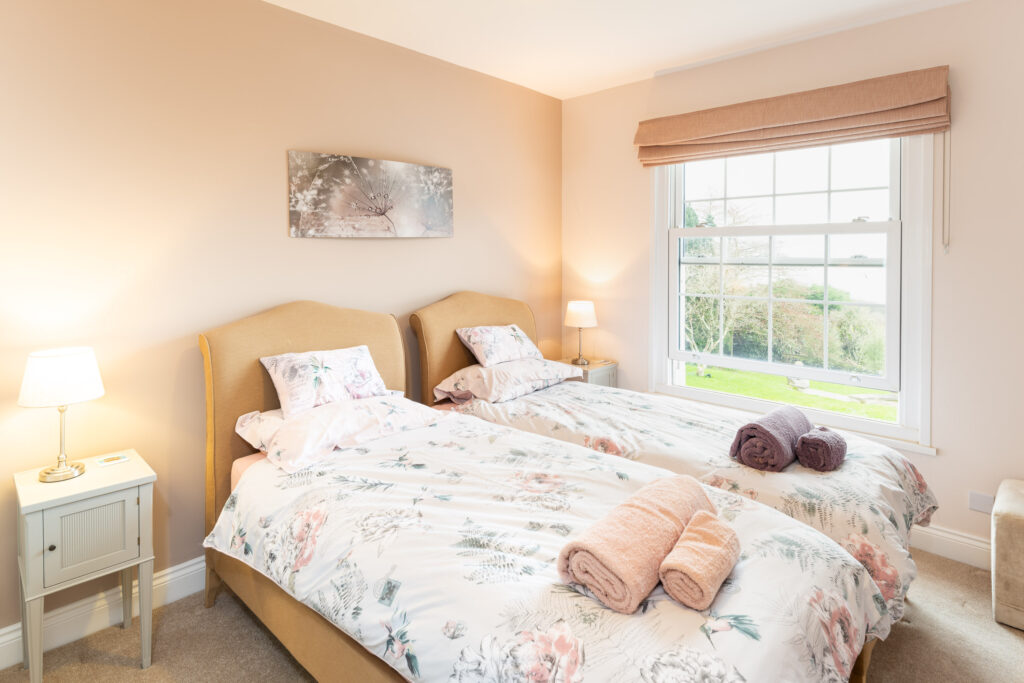 spare bedroom at holiday cottage with views out to sea